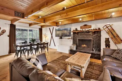 a living room with a couch and a fireplace at Camp Conklin #2337 in Big Bear Lake