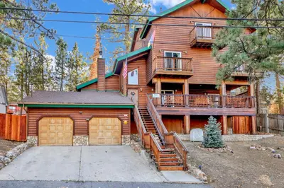 a large wooden house with a garage at Temple Bear Chalet #2507 in Big Bear Lake