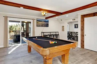 a pool table in a living room with a pool at Temple Bear Chalet #2507 in Big Bear Lake