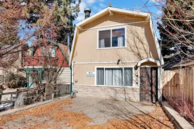 a house with a gate and a fence at Aeroplane Gambrel #2509 in Big Bear City