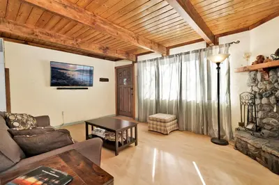 a living room with a couch and a table at Aeroplane Gambrel #2509 in Big Bear City