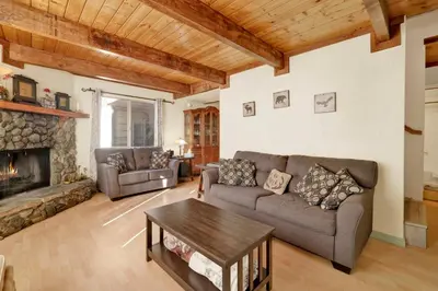 a living room with a couch and a fireplace at Aeroplane Gambrel #2509 in Big Bear City