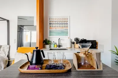 a kitchen with a tray with a blender on a table at Sleek Luxury Studio with Patio LAX & Beach Access in Los Angeles