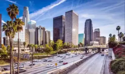 a view of a city with cars on a highway at Charming 2BR Condo with Onsite Parking Included in Los Angeles
