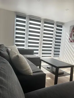 a living room with a couch and a table at 6 miles from Disney, Book your dream vacations! in Fullerton