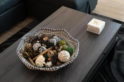 a basket of mushrooms on a table with a candle at Chic 3-bed Apt with Pool & Hot Tub in Heart of DTLA in Los Angeles