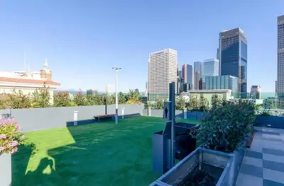 a rooftop garden with a view of the city at Modern 3 Bedroom High-Rise with resort Pool in Los Angeles