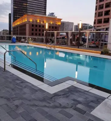 a large swimming pool on top of a building at Modern 3 Bedroom High-Rise with resort Pool in Los Angeles