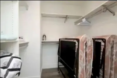 a room with two mirrors and a rack with clothes at Stunning 3 Bedroom High-Rise with Pool, Spa, and Rooftop Views in Los Angeles