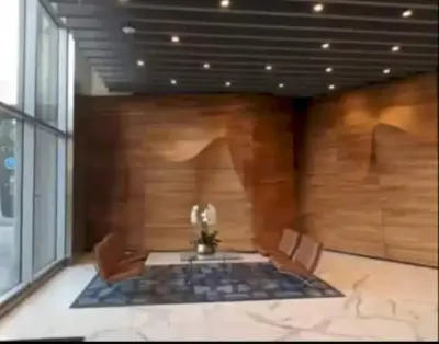 a room with a table and chairs in a building at Stunning 3 Bedroom High-Rise with Pool, Spa, and Rooftop Views in Los Angeles