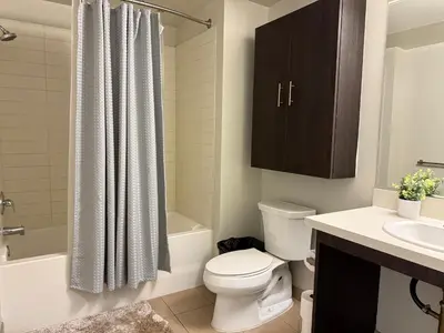 a bathroom with a toilet and a sink and a shower at Studio Suite - Walk to Convention Center and Crypto Arena in Los Angeles