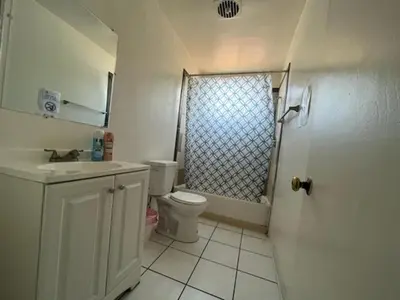 a bathroom with a toilet and a sink and a shower at The Disney Hostel - Fullerton - OC in Fullerton