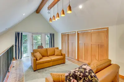a living room with a couch and a table at Game Room and Deck Pet-Friendly Lake Arrowhead Home in Lake Arrowhead