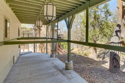 a covered walkway on a building with lights at Game Room and Deck Pet-Friendly Lake Arrowhead Home in Lake Arrowhead