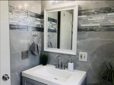 a bathroom with a sink and a mirror at 4bed 2ba Hollywood house Block away from sunset, Free parking, private backyard in Los Angeles