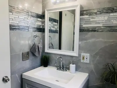 a bathroom with a sink and a mirror at 4bed 2ba Hollywood house Block away from sunset, Free parking, private backyard in Los Angeles