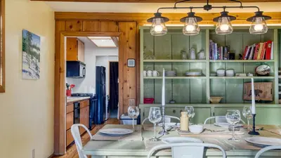 a dining room with a table and chairs at Lakefront w Private Dock Hot Tub Large Deck Views Lakeside on Lagunita in Big Bear Lake