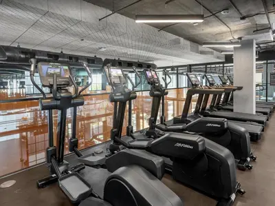 a row of cardio machines in a gym at Modern Stay in Arts District LA in Los Angeles