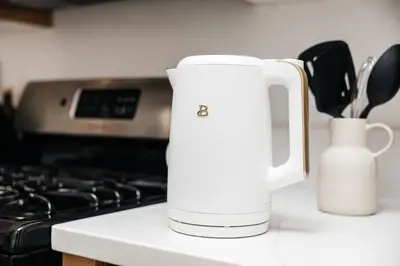 a white jug sitting on a counter next to a stove at Seaside Serenity - Chic Santa Monica Studio in Los Angeles