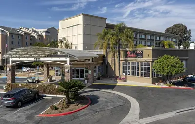 a parking lot in front of a hotel at Pacific Stay Hotel in West Covina