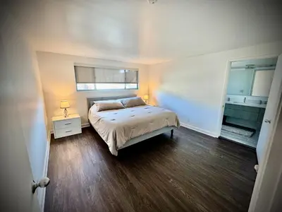 a bedroom with a bed and a window in it at Masion de Beverly Hills in Los Angeles