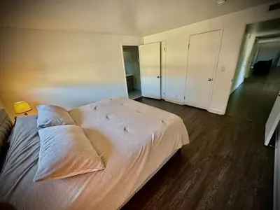 a bedroom with a large bed with two pillows on it at Masion de Beverly Hills in Los Angeles