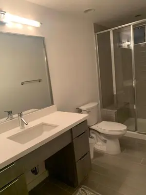 a bathroom with a sink and a toilet and a shower at Masion de Beverly Hills in Los Angeles