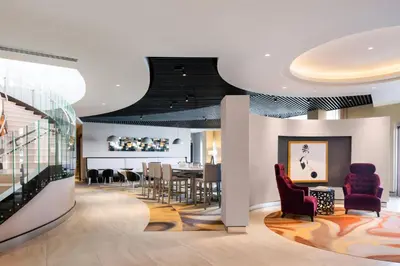 a dining room with a table and chairs at SpringHill Suites by Marriott Los Angeles Burbank/Downtown in Burbank