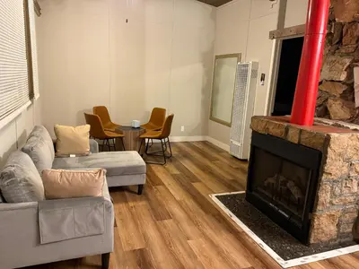a living room with a couch and a fireplace at Studio 9 Big Bear Lake in Big Bear Lake
