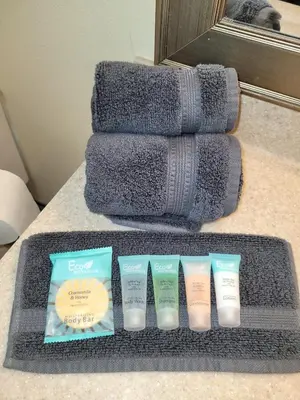 a set of four products sitting on a counter next to a towel at Alpaca Rustic Ranch-peaceful & breathtaking views in Santa Clarita