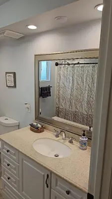 a bathroom with a sink and a large mirror at Alpaca Rustic Ranch-peaceful & breathtaking views in Santa Clarita