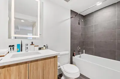 a bathroom with a sink and a toilet and a tub at 8 Santa Monica Huge Stylish Apartment in Los Angeles
