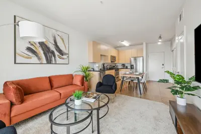 a living room with a couch and a table at Marina del Rey getaway,Free parking,Pool,Hot Tub in Los Angeles