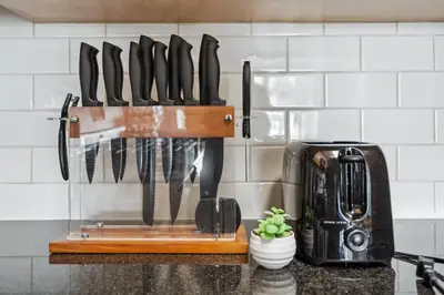 a rack of knives hanging on a kitchen wall at Marina del Rey getaway,Free parking,Pool,Hot Tub in Los Angeles