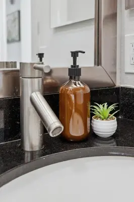 a bathroom sink with a soap dispenser on a counter at Marina del Rey getaway,Free parking,Pool,Hot Tub in Los Angeles