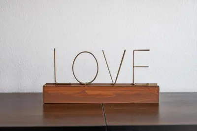 a sign that says love on top of a wooden table at Marina del Rey getaway,Free parking,Pool,Hot Tub in Los Angeles