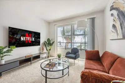 a living room with a couch and a tv at Marina del Rey getaway,Free parking,Pool,Hot Tub in Los Angeles