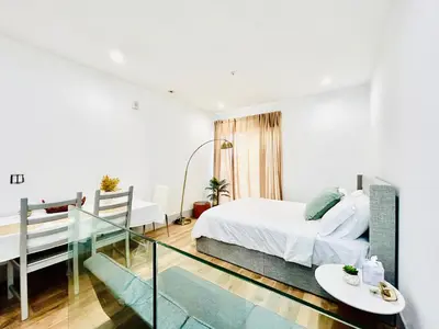 a bedroom with a bed and a glass staircase at New Lux Skyline Loft in LA in North Sherman Way