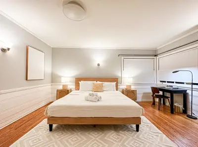 a bedroom with a large bed and a desk at Charming 4 Bedrooms Family House - WIL-WW in Los Angeles