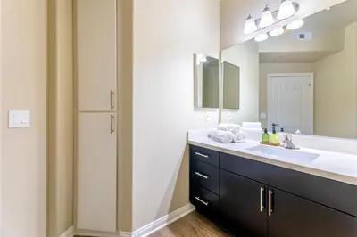 a bathroom with a sink and a mirror at Marina del Rey 1bdr Retreat with pool, gym, free parking in Los Angeles