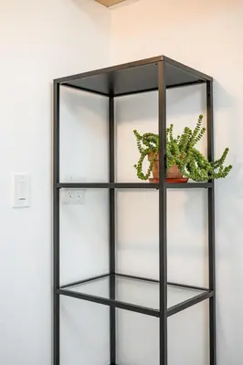 a black glass shelf with a potted plant at Scenic Retreat with Deck & Stunning Views in LA in Glendale