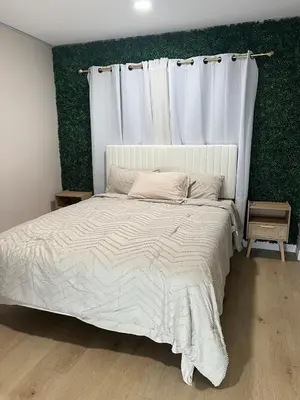 a bedroom with a white bed with a white curtain at Luxury Home LA Big Bear & LV 5 Mins to Mall in Victorville