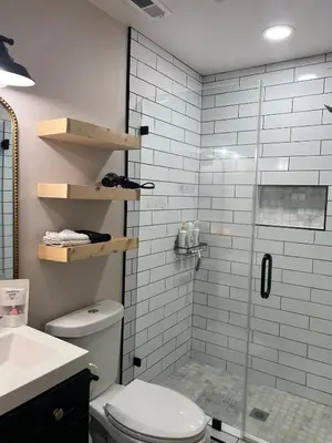 a bathroom with a shower with a toilet and a sink at Luxury Home LA Big Bear & LV 5 Mins to Mall in Victorville
