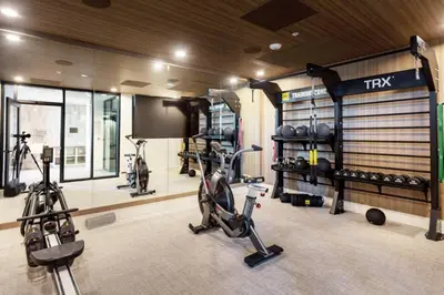 a gym with two exercise bikes in a room at Blueground San Pedro AC balcony nr USS Iowa LAX-1301 in Los Angeles