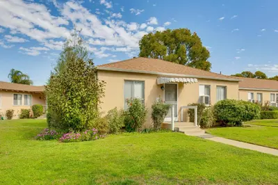 a house with a green yard at 2 Mi to Griffith Park Chic Home with Private Patio in Burbank