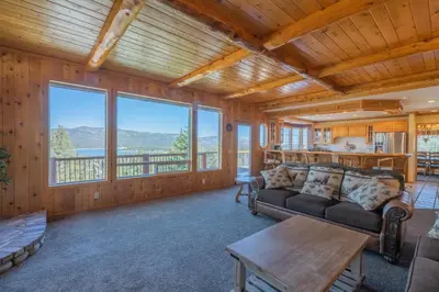 a living room with a couch and a table at Valley View Cabin in Big Bear Lake