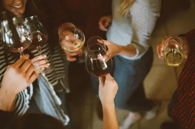 a group of people holding up wine glasses at Contemporary Classic on a Private Mountain Lake in Lake Arrowhead