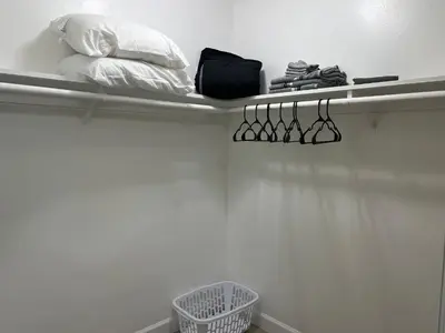 a shelf with glasses and a pillow on a wall at NoHo Cozy Cove in Burbank