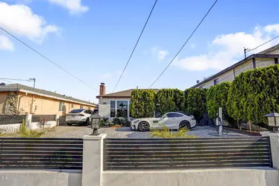 a group of cars parked in a parking lot at The Pacific Nest - 10min from LAX in Hawthorne
