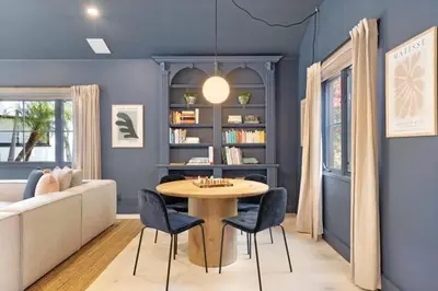 a living room with a table and a couch at Malibu Park by Stay Awhile Villas in Malibu